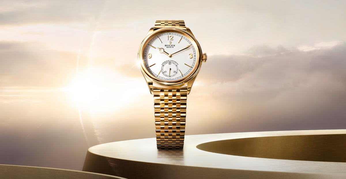 Rolex 1908 wristwatch in polished yellow gold with a classic round case, fluted bezel, elegant white dial, and matching yellow gold bracelet, blending timeless craftsmanship with modern sophistication