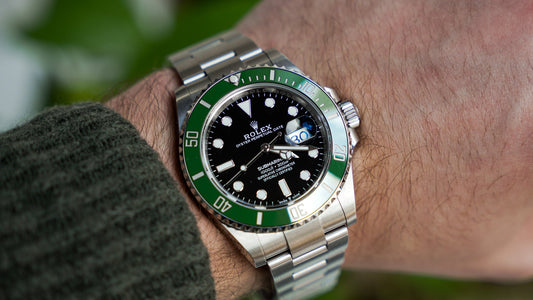 Watch repair technician polishing and restoring a scratched watch case