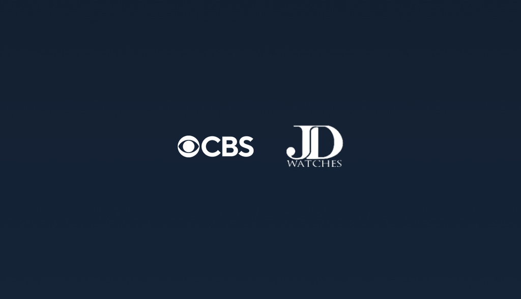CBS x JD Watches logos on dark blue background