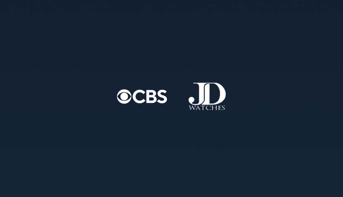 CBS x JD Watches logos on dark blue background