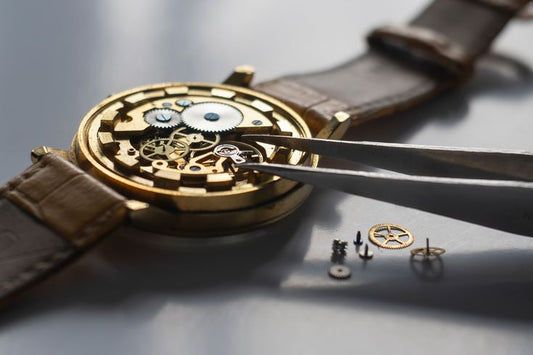 Watch repair technician polishing and restoring a scratched watch case