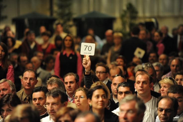 Luxury watch auction hall during record-breaking bidding for the most expensive watches ever sold