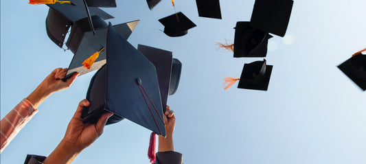 Graduation hats soaring into the sky, celebrating a joyful milestone with friends and family—symbolizing success, freedom, and new beginnings
