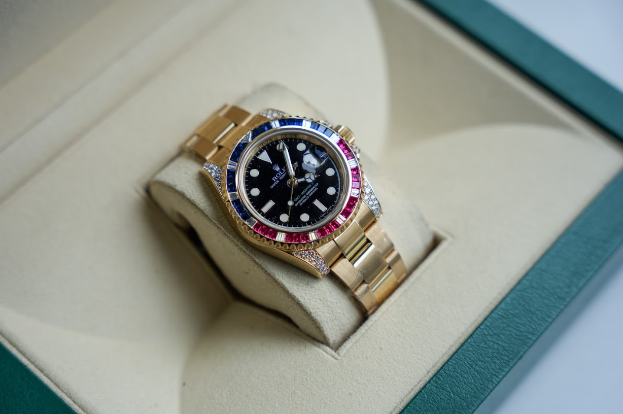 Rolex GMT-Master II 116758SARU 18K Yellow Gold Black Dial