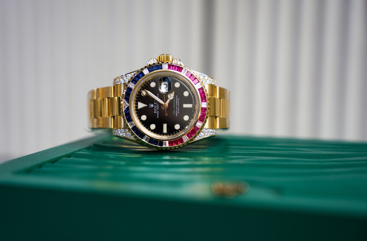Rolex GMT-Master II 116758SARU 18K Yellow Gold Black Dial