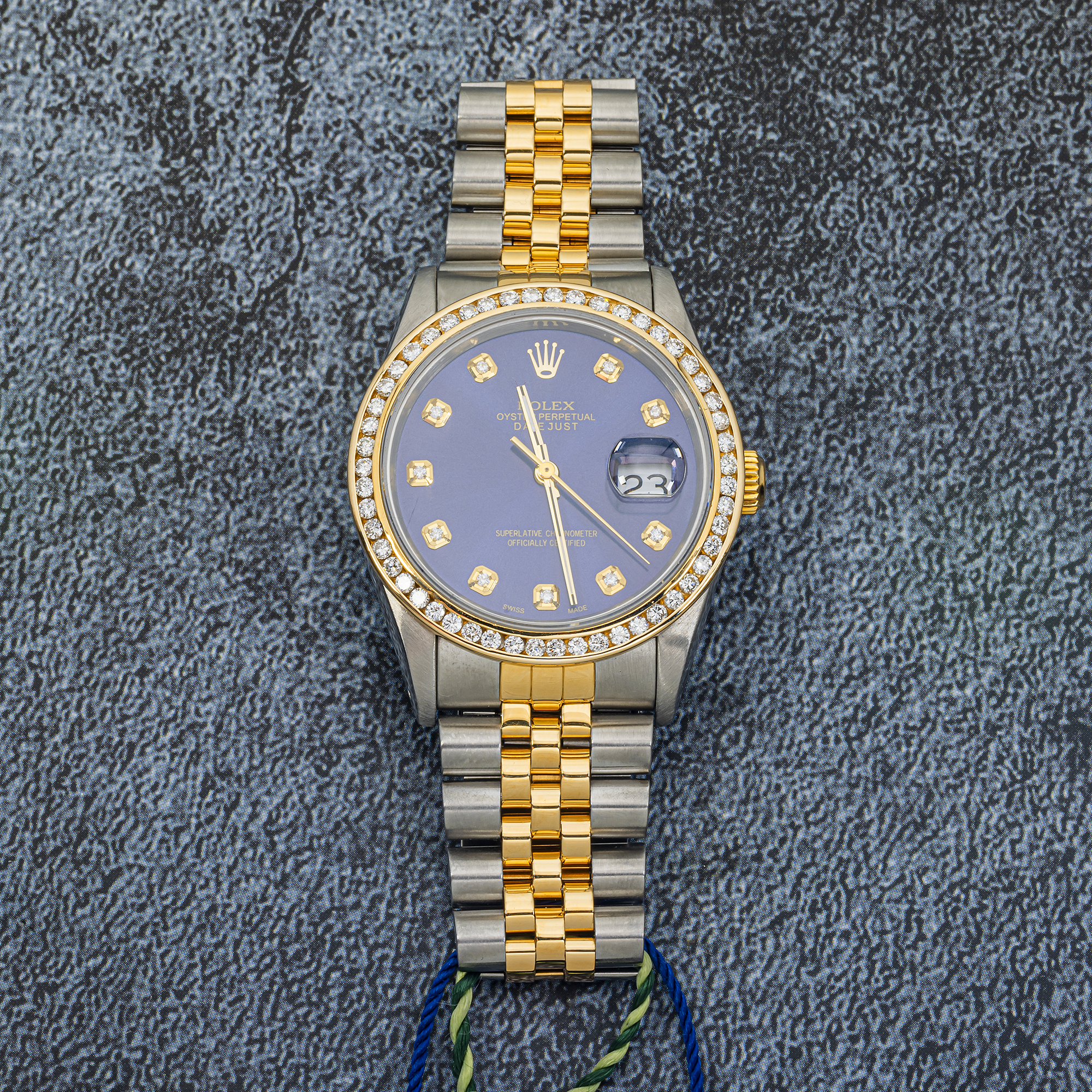 Rolex Datejust 16233 with blue aftermarket diamond dial and diamond bezel. Two-tone 36mm Jubilee bracelet luxury timepiece.