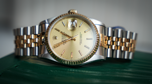 Rolex Datejust 36 – Steel & Yellow Gold Champagne Tapestry Dial Ref. 16233