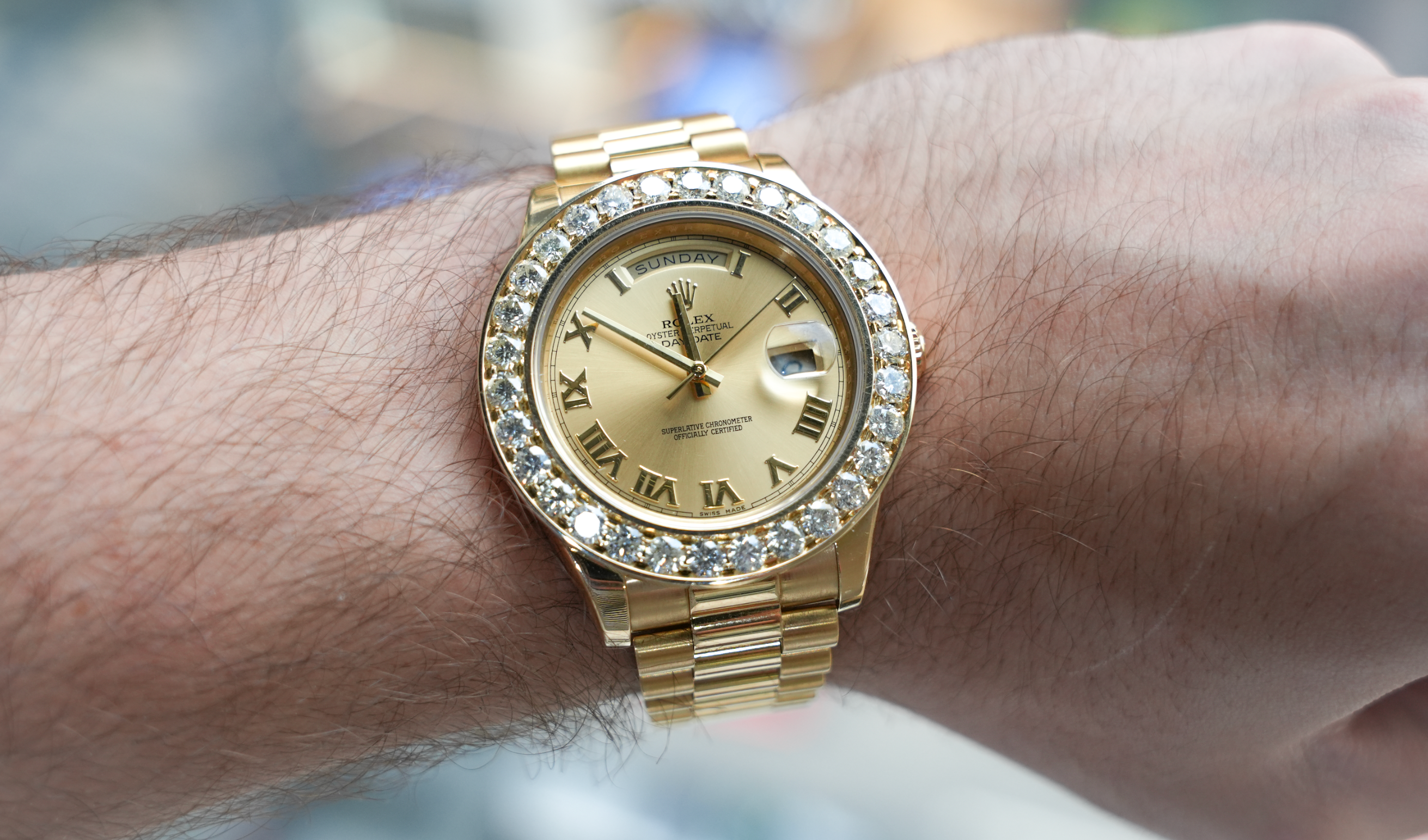 Rolex Day-Date 41 18k Yellow Gold Champagne Roman Dial – Ref. 218238 – Aftermarket Diamond Bezel