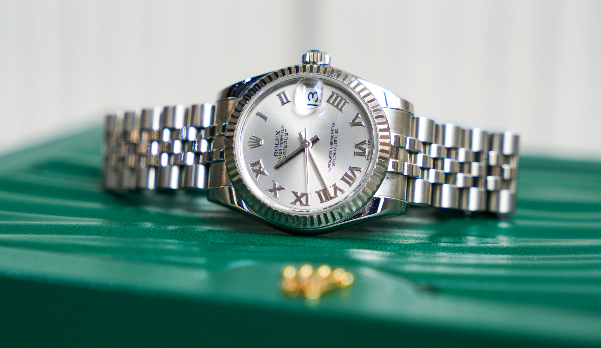 Rolex Datejust 31mm – Stainless Steel with Silver Roman Dial & White Gold Fluted Bezel | Ref. 178274