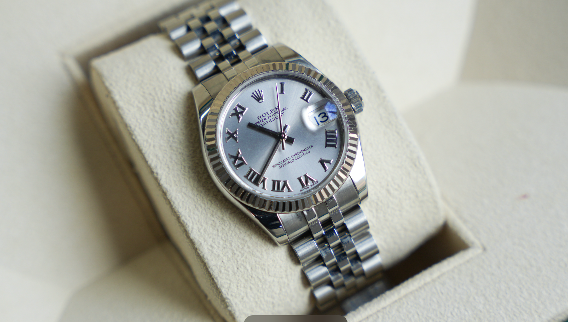 Rolex Datejust 31mm – Stainless Steel with Silver Roman Dial & White Gold Fluted Bezel | Ref. 178274