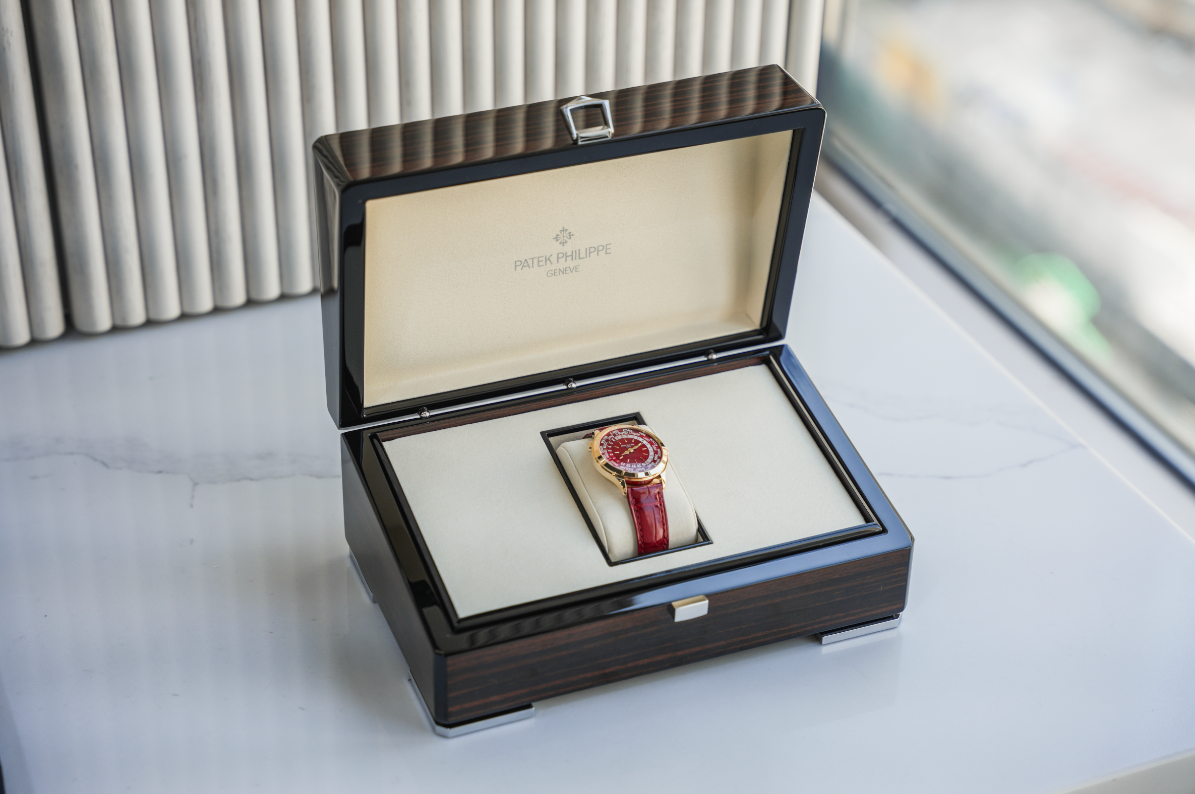 Patek Philippe Complications World Time 7129J-001 18K Yellow Gold Carmine Red Dial