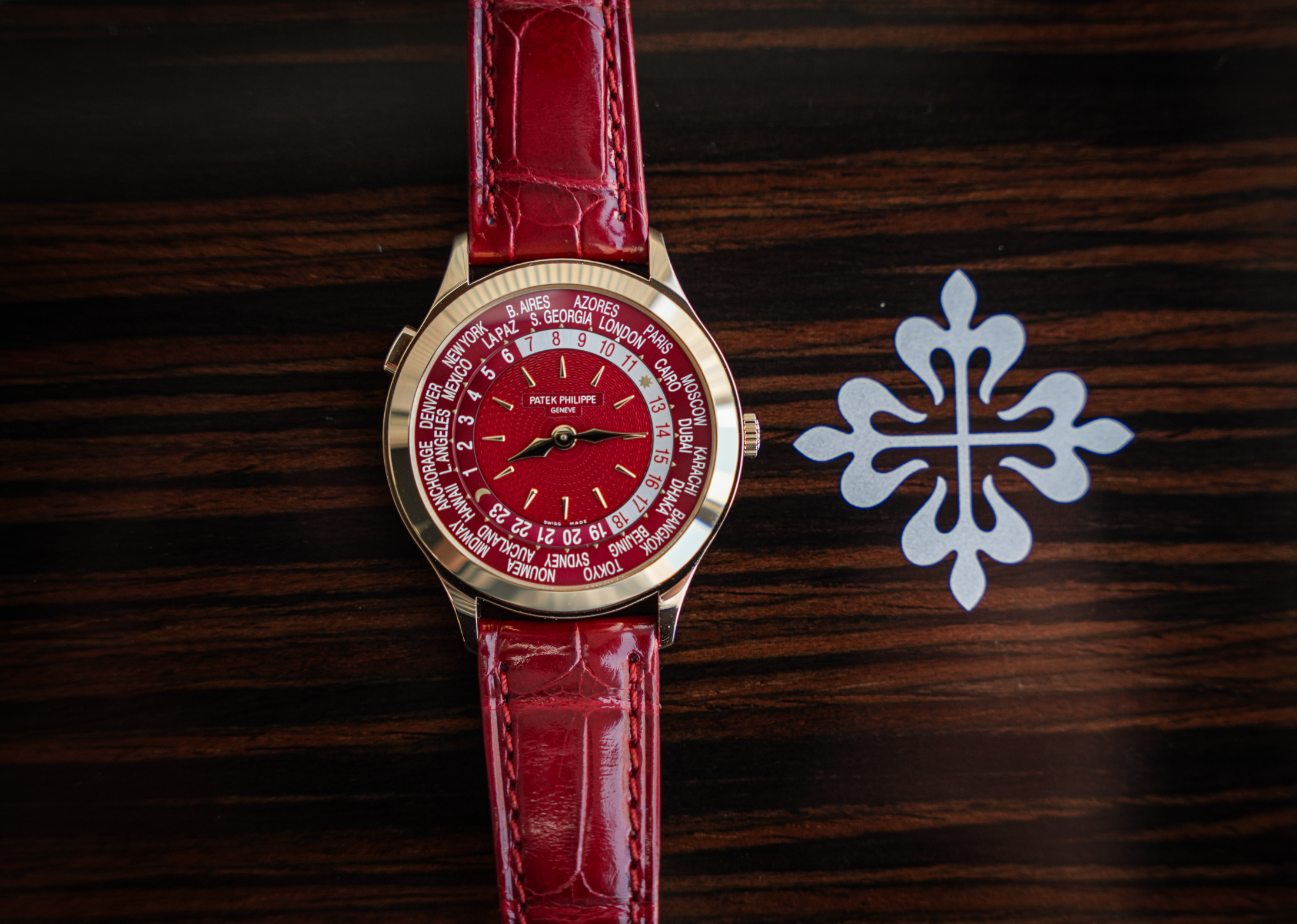 Patek Philippe Complications World Time 7129J-001 18K Yellow Gold Carmine Red Dial