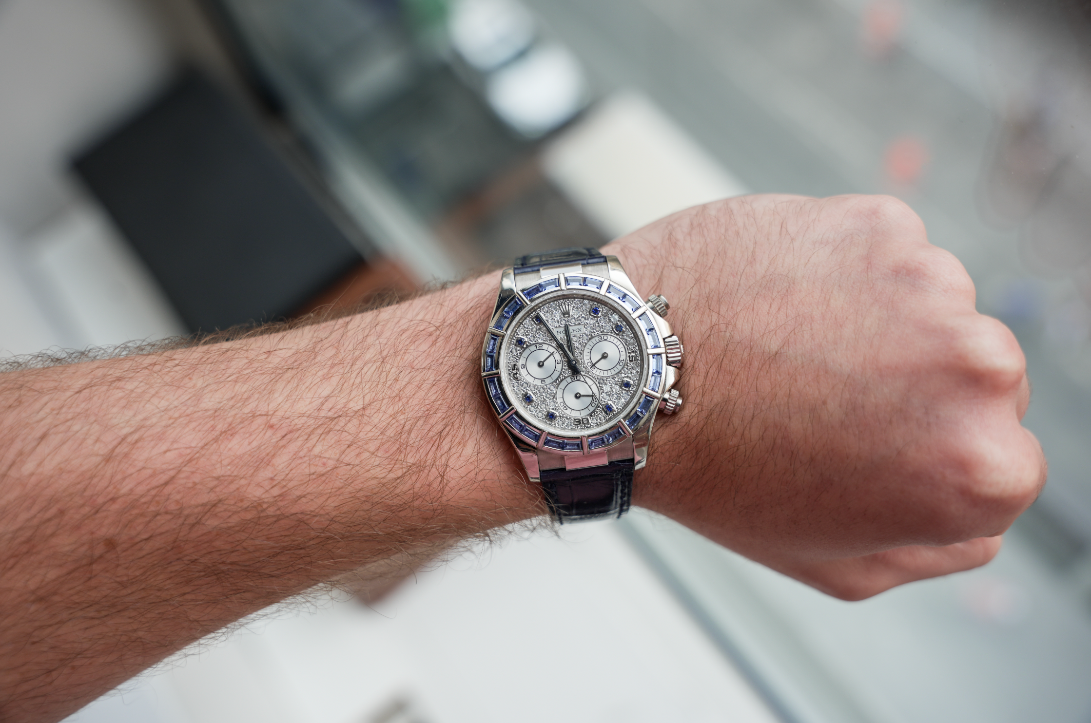 Rolex Cosmograph Daytona 40mm 18K White Gold Blue Sapphire Bezel Diamond Pavé Dial Blue Alligator Strap – Ref. 116589SACI