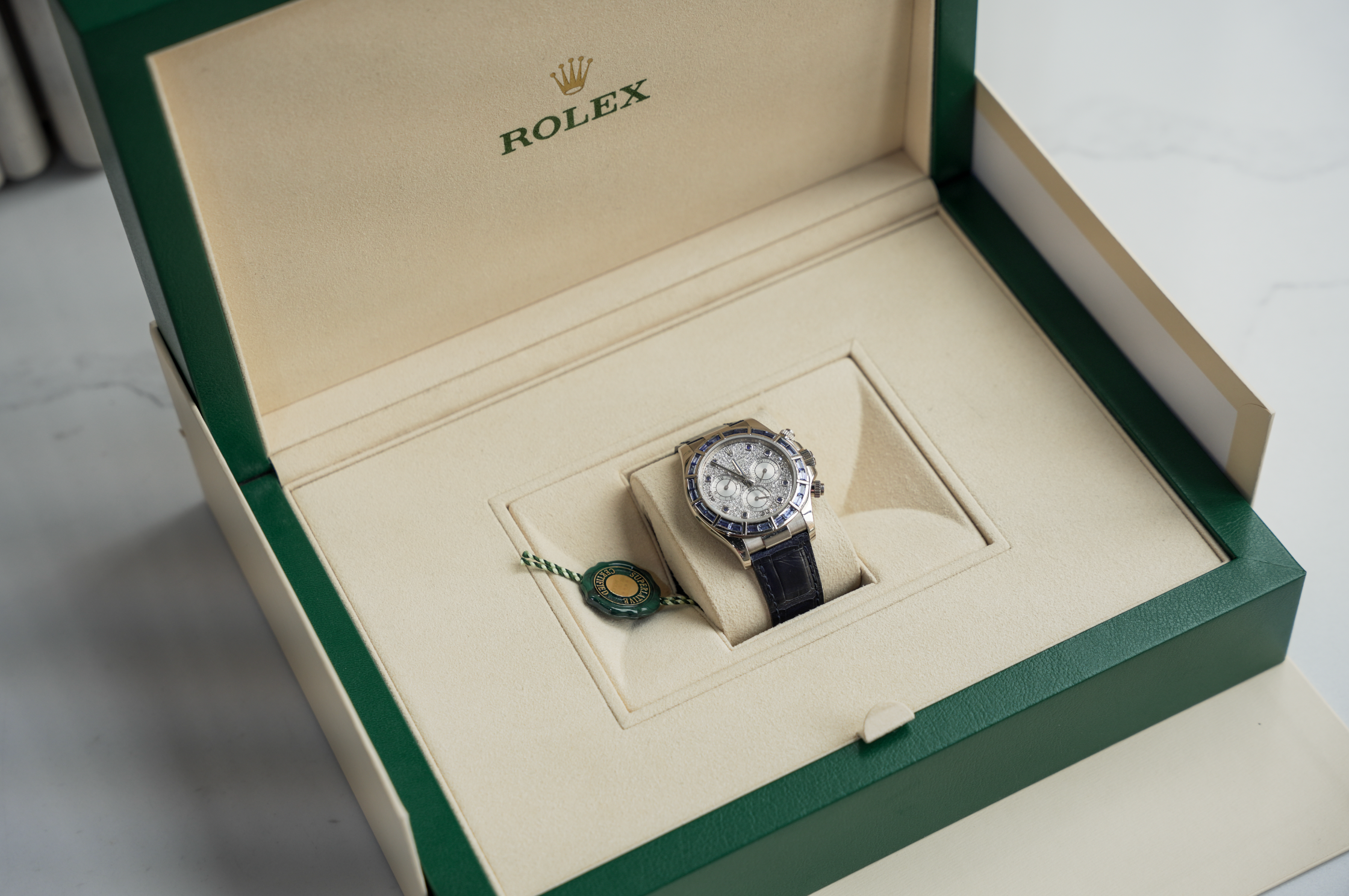 Rolex Cosmograph Daytona 40mm 18K White Gold Blue Sapphire Bezel Diamond Pavé Dial Blue Alligator Strap – Ref. 116589SACI